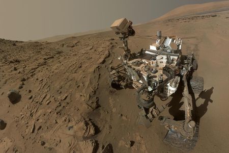 NASA's Curiosity Mars rover used the camera at the end of its arm last April and May to take dozens of images that were combined into this self-portrait.