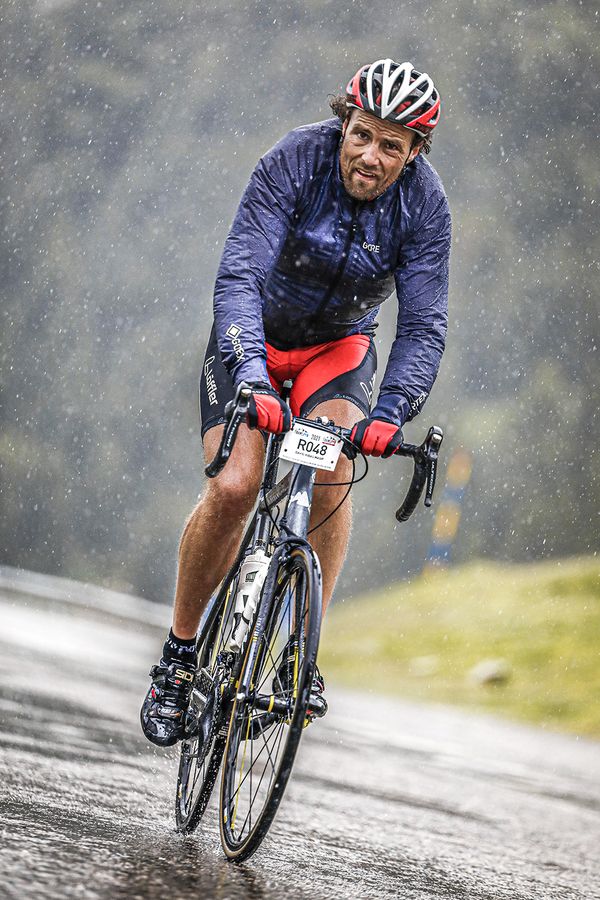 A cyclist suffering the Transpyr race during the rain thumbnail