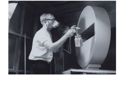 Photograph of Tony DeLap spray painting sculpture in Costa Mesa studio (detail), 1970 March / unidentified photographer. Tony DeLap papers, circa 1950-2015. Archives of American Art, Smithsonian Institution.
