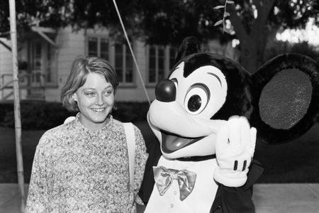 Actress Jodi Foster in 1985 with an interactive Mickey Mouse created the old fashioned way. 