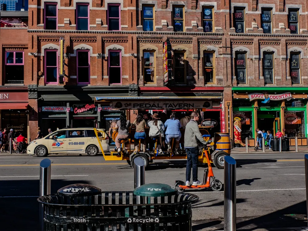 A man on a scooter in the street