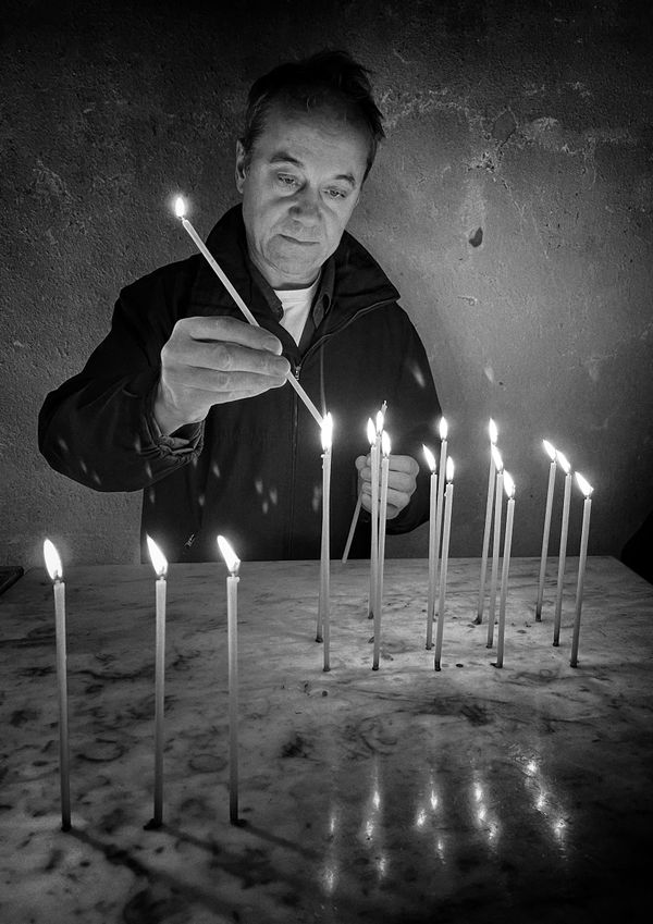 Miloje lights a candle at Monastery Studenica, Serbia thumbnail