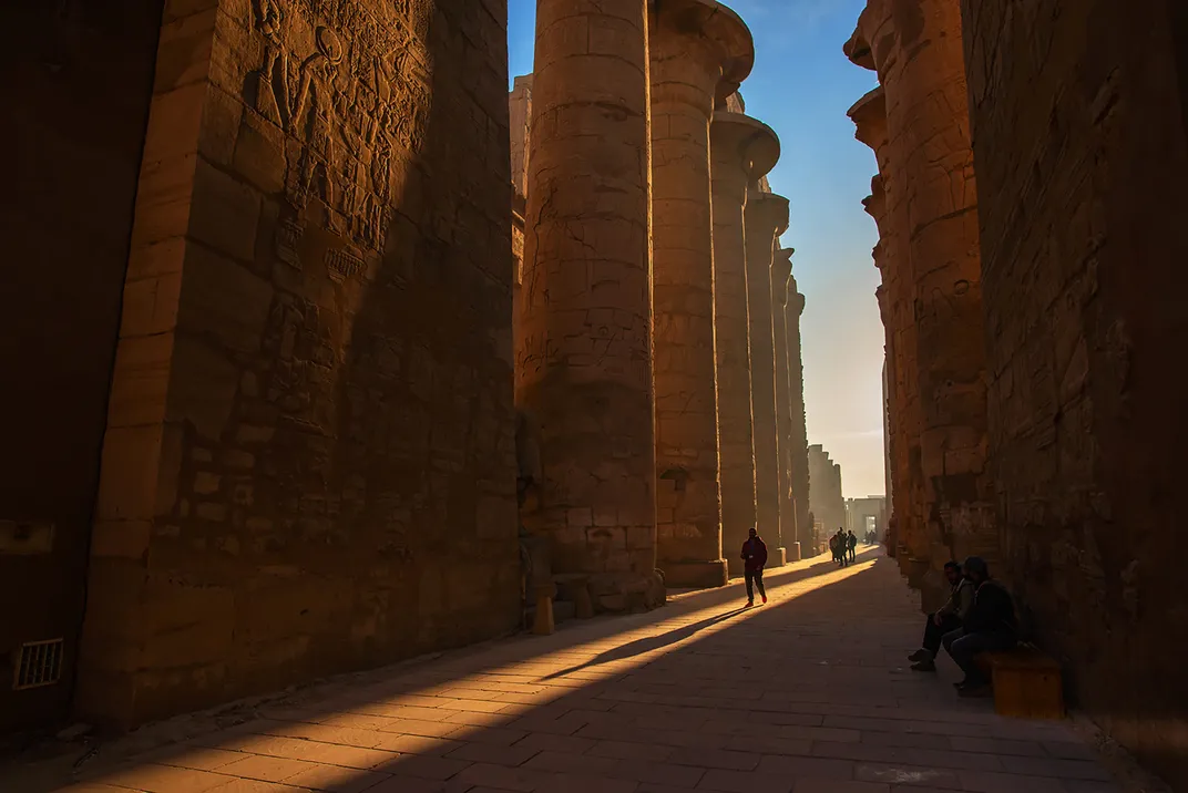 11 - Large columns line a pathway at the Karnak Temple.