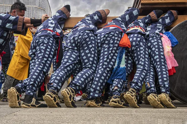 A Group of Japanese Men Pushing a float thumbnail