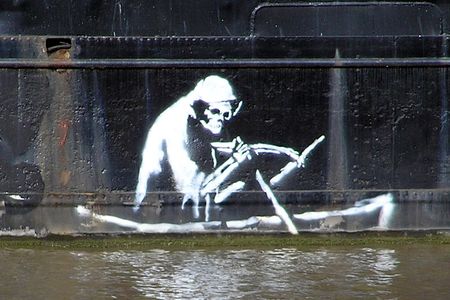 Stencil by Banksy on the waterline of The Thekla