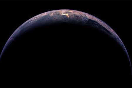 Part of South America and Antarctica are sunlit in a crescent Earth photographed by Rosetta during a November 12, 2009 flyby.