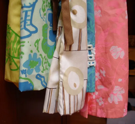 Two Lilly Pulitzer dresses on the far right along with Vested Gentress dresses.