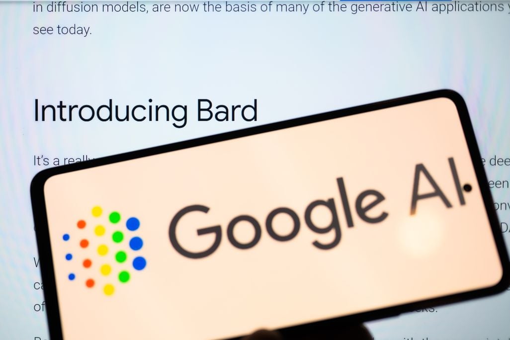 A phone that reads Google AI in front of a screen with the words "introducing bard"