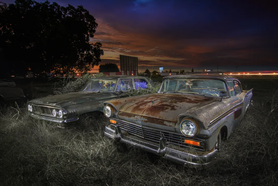 The Galaxy Drive-In movie theater would once have been the place these rust-covered Ford cars, a 1957 Fairlane and a 1964 Galaxie, could be found on a Friday night.