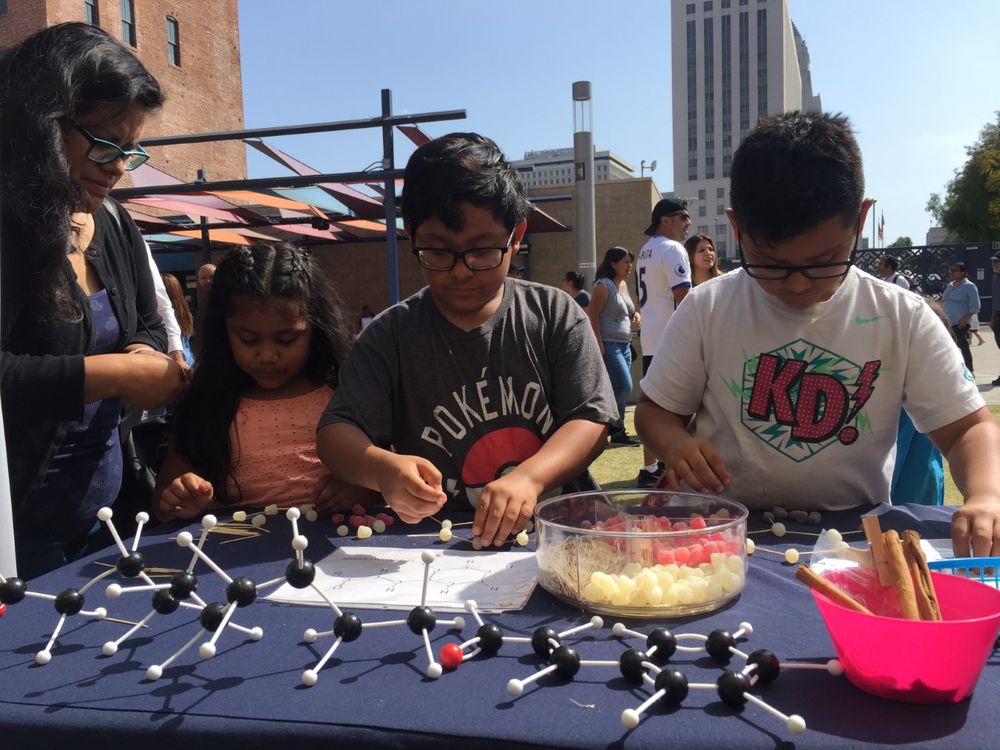 Children participate in a hands-on science activity with the Smithsonian Latino Center for a Dia del Niño festival hosted by LA Plaza de Cultura y Arte in Los Angeles, California. (Smithsonian Latino Center)