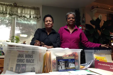 Mills (left) and Buck (right) use painstakingly gathered documents to spread knowledge of local black history.