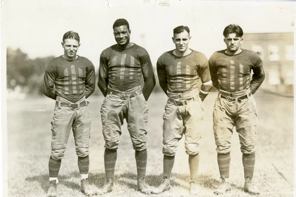 Jack Trice (second from left) and three of his teammates on the varsity football team
