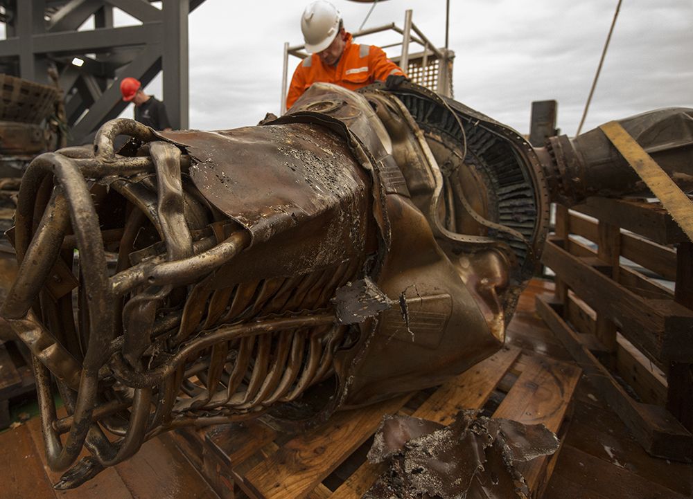 Workers clean the salvaged F-1 engine