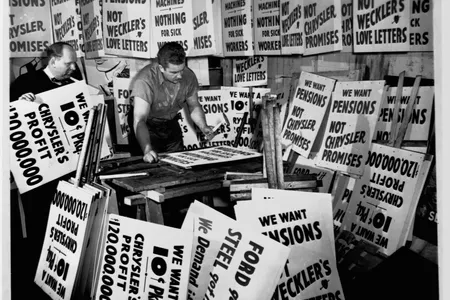 Signmakers Stanley Sawicki and Stanley Palka prepare several thousand picket signs in 1950 for a possible Chrysler auto workers' strike over employee pensions.