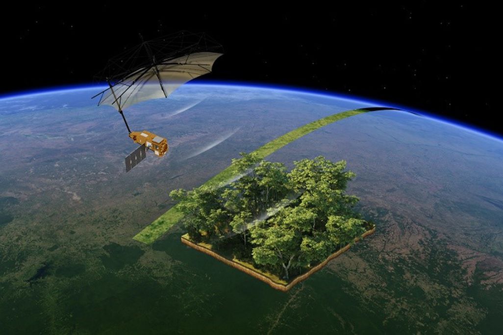 A digital rendition of a satellite above a rainforest