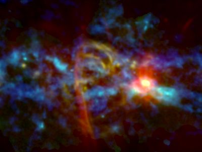 An image of the center of the Milky Way galaxy, where a red and yellow "candy cane" feature was recently observed by astronomers