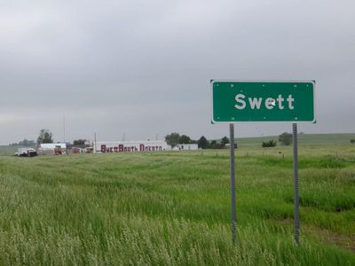 Never fear—Swett, SD's town sign has been replaced with one that doesn't have bullet holes. 