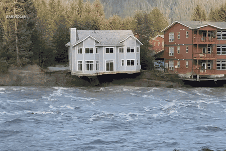 A house collapses into the Mendenhall River.