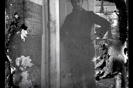 The Shackleton expedition's scientist, Alexander Stevens, stands on one of the team's ships, the Aurora.