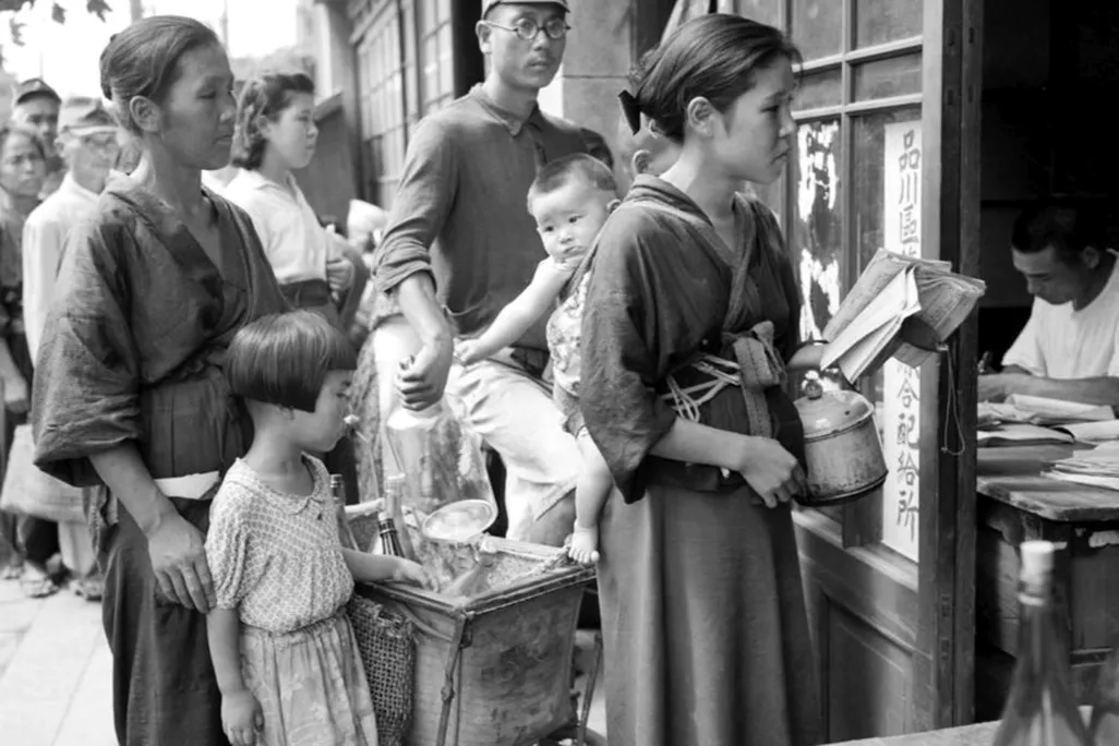 People lining up for rations of beans in Japan