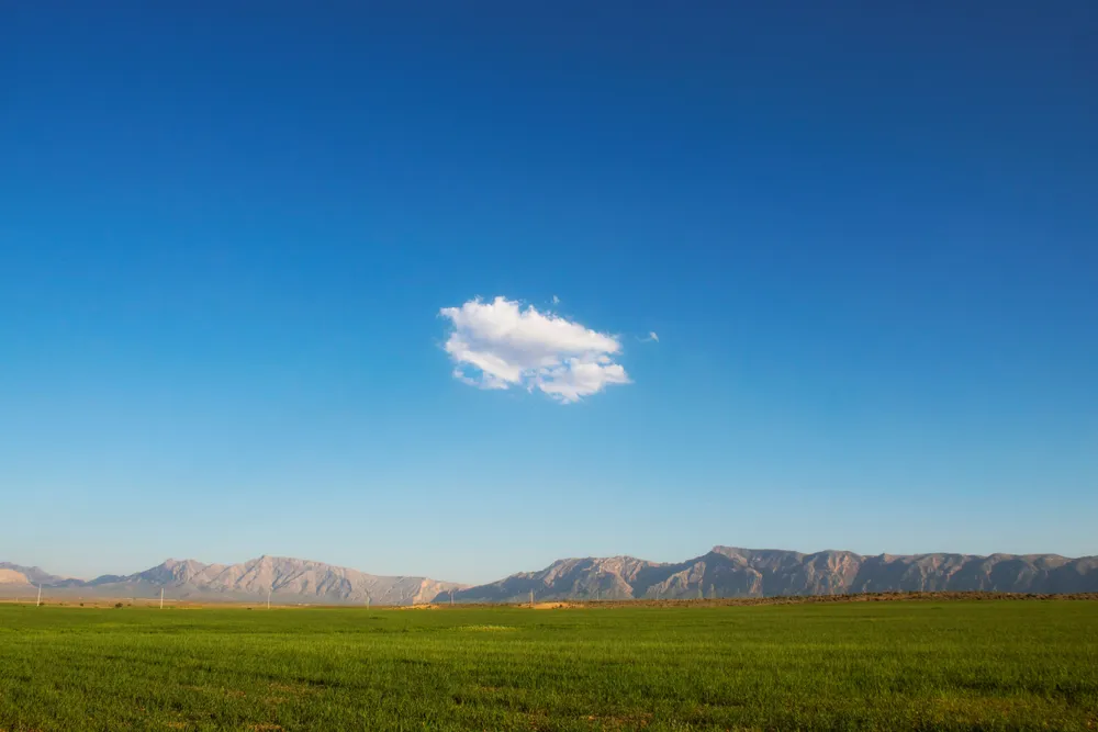 A cute single cloud is floated in the blue sky to show spring.
