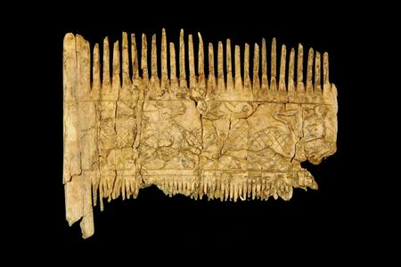 The ivory comb shows gazelle-like animals attempting to escape predators.