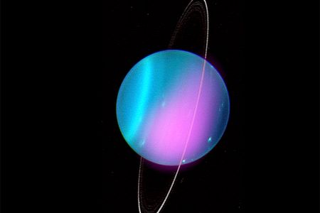 The pink splotch on the planet shows the X-rays detected in 2002 imposed on a photo of Uranus taken in 2004 at the same orientation.

