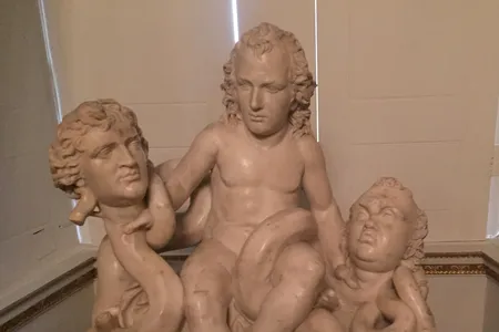 An Italian marble sculpture of William Pitt the Younger as the Infant Hercules Strangling the Serpents Fox and North by Pieratoni (called ’Sposino’), c.1790