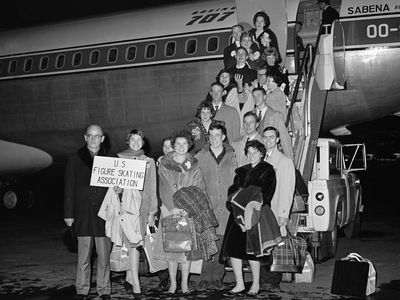 Members of the U. S. figure skating team pose before boarding a Belgian Sabena airline plane at New York&#39;s Idlewild Airport on February 14, 1961. The plane crashed on February 15 near Brussels Airport, killing all on board.