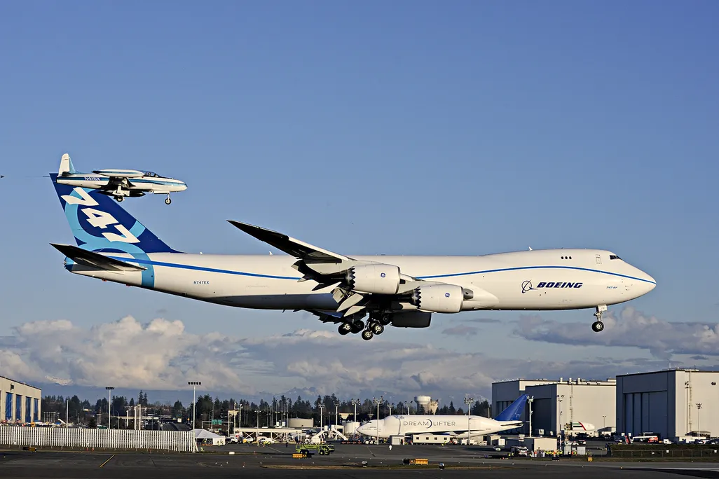 The Boeing behemoth on its first flight (with Lockheed T-33 chase plane), last February.