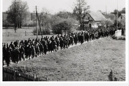 The exhibition includes clandestine photographs of Nazi death marches. This image, taken by Maria Seidenberger, depicts a forced march from Buchenwald to Dachau.