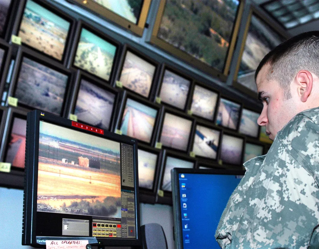 member of the National Guard monitors camera feeds