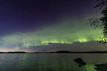 A new type of aurora, called auroral dunes, produces horizontal, undulating stripes of green that resemble mounds of sand on a beach.
