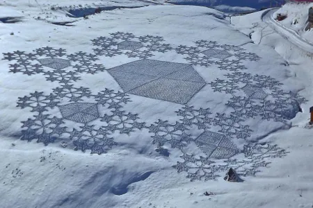 Snowflakes seem a natural choice for a pattern in the snow-covered field, but they also showcase Beck's mathematical precision.