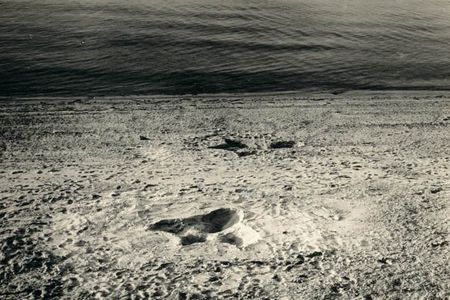 A photo of the two giant footprints that appeared on the shores of a Nantucket beach in August 1937.