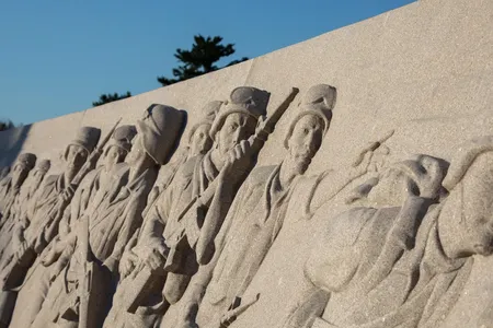 The memorial features a 125-foot bas-relief created by sculptor Emily Bedard that moves chronologically from the buildup of the operation to the conflict and liberation.