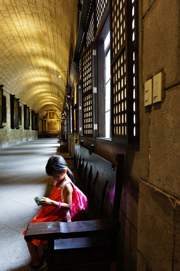 Young girl checking her camera in San Agustin Church, Manila. thumbnail