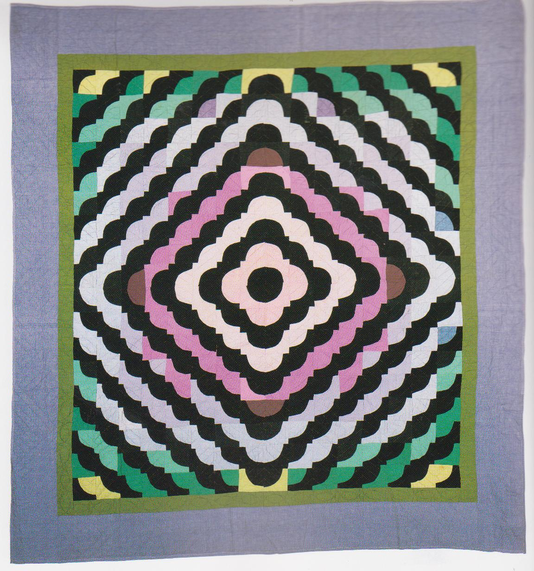 Colorful handmade quilt with a diamond pattern