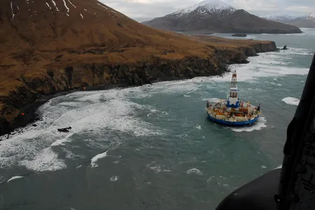 In a photo taken on January 3, 2012, Royal Dutch Shell's Kulluk drilling rig sits grounded off the Alaskan coast. 