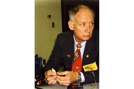 William Maples holds a bone fragment during a presentation about the Romanov Investigations, circa 1992.