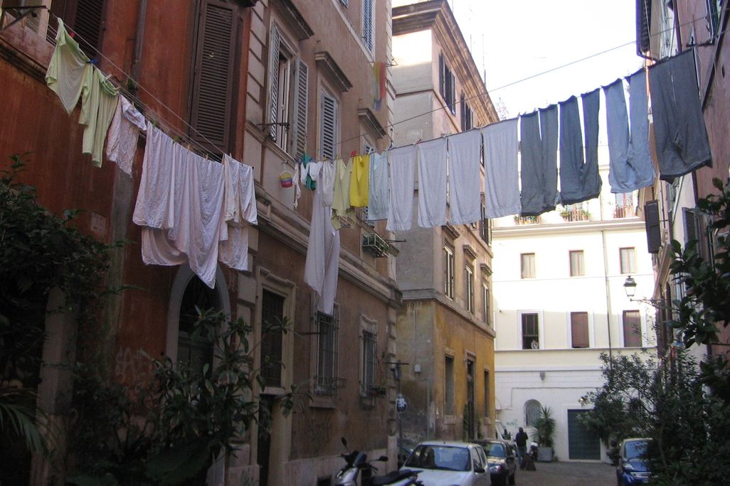 Laundry is hung to dry above an Italian street