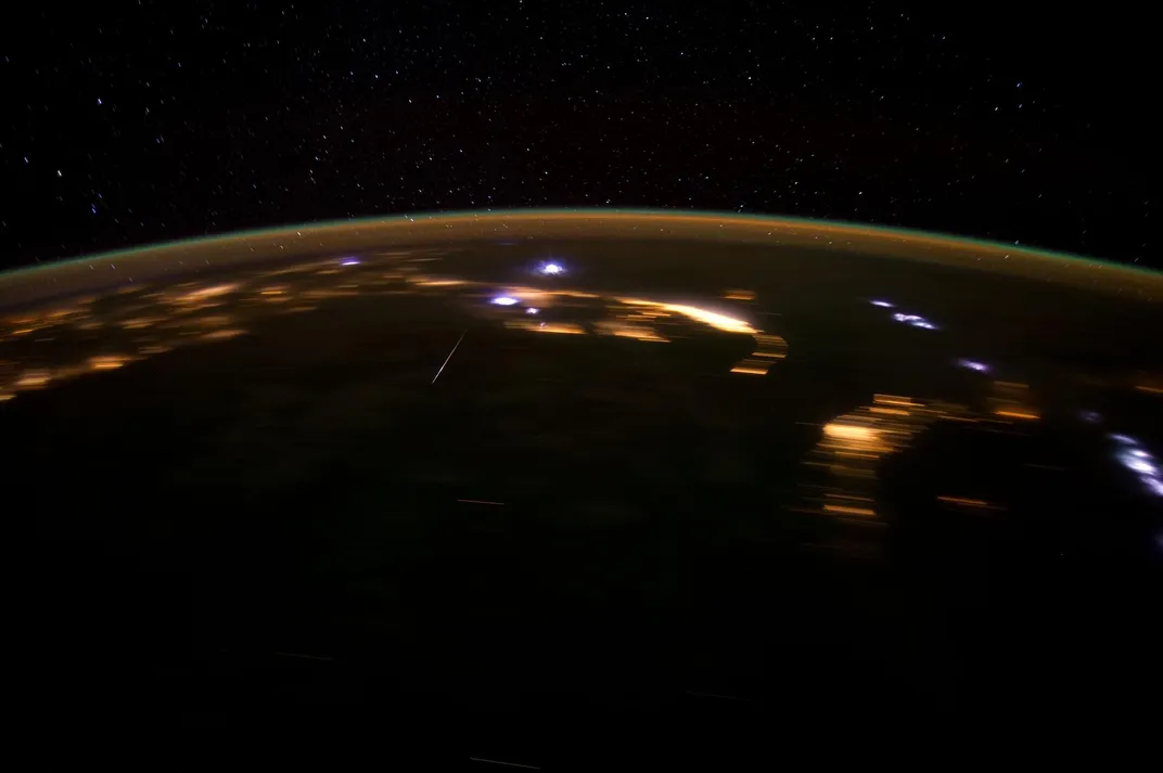 the earth seen from space, with bright bursts on top