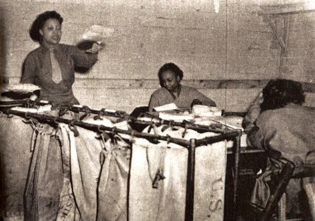 Members of the 6888th Central Postal Directory Battalion sort mail for U.S. troops during World War II.