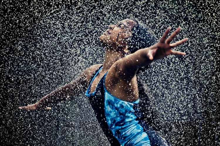 A girl in sprinklers