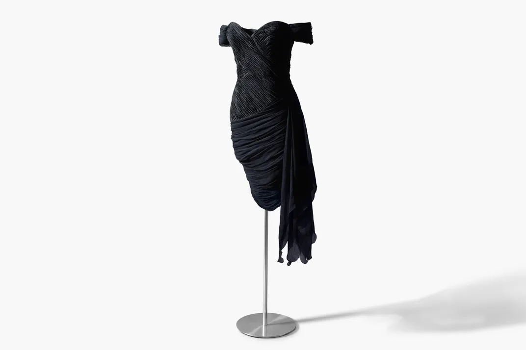 A black gown against a white backdrop