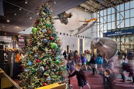 A Christmas tree decorated with iconic spacecraft is on view on the first floor of the Air and Space Museum