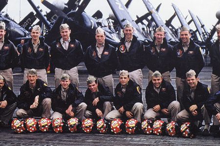 The squadron pilots pose on Valley Forge in July 1952, with 13 flight helmets for their fallen colleagues. Among the survivors are Cleland (back row, middle), Edinger (to his immediate left), and Balser (to Cleland’s right).