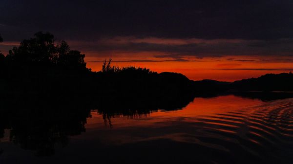 A late night photo captured on a boat in a Norwegian fjord. thumbnail