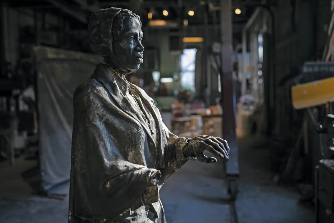 an unfinished statue of Sojourner Truth in a foundry