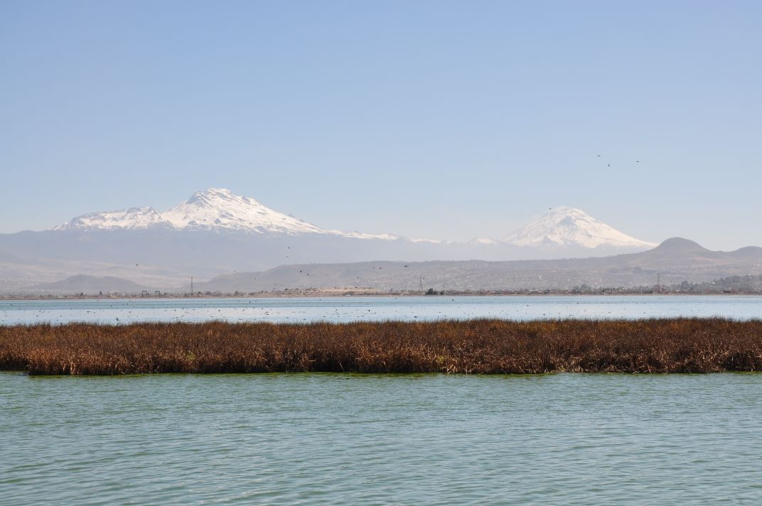 Mexico’s volcanoes Popocatépetl and Iztaccihuatl can be seen on a clear day from Lake Nabor Carrillo